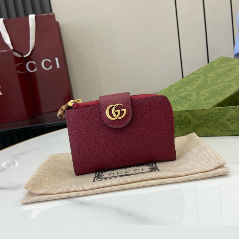 G*u*i clutch bags